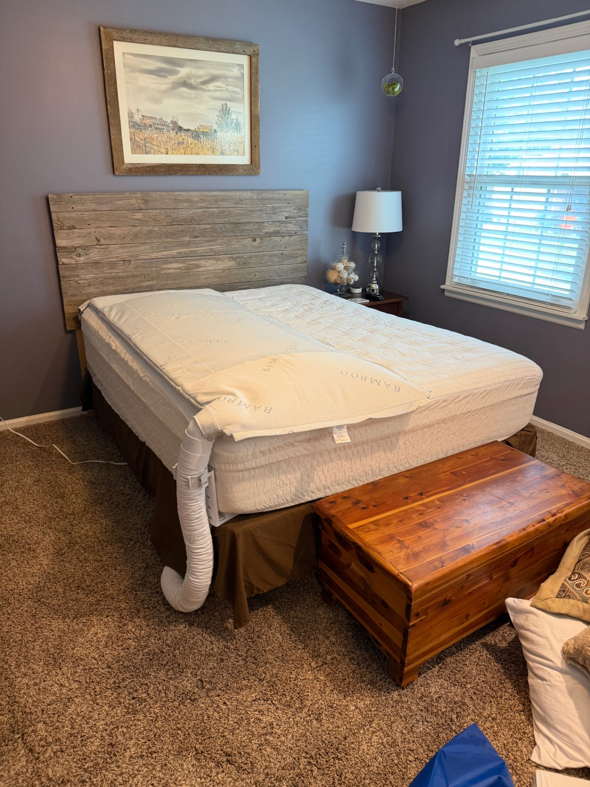BJet Hack replacement topper installed on a bed with airflow hose